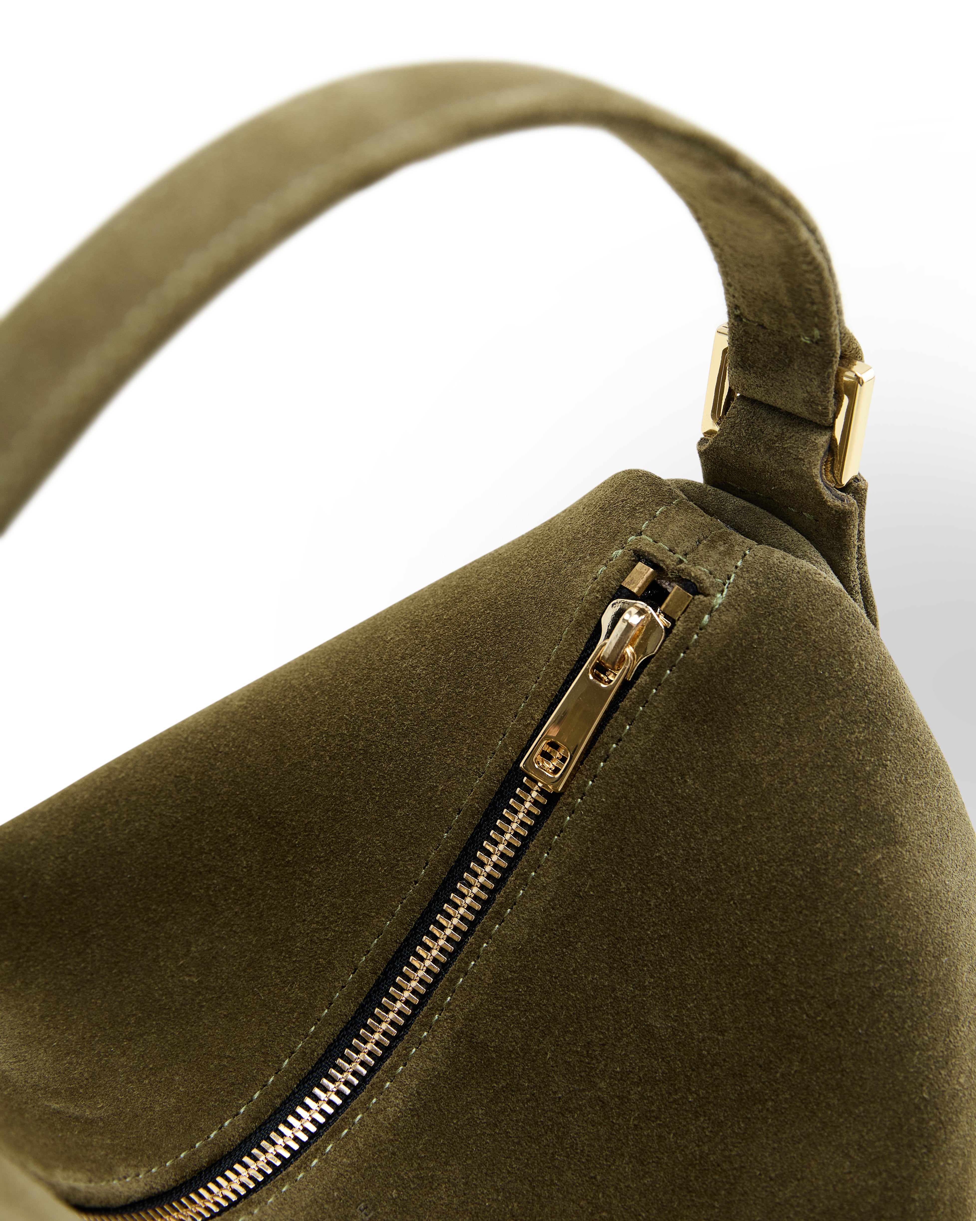 Poelle Atelier luxury olive suede handbag with gold zipper and soft suede texture close-up