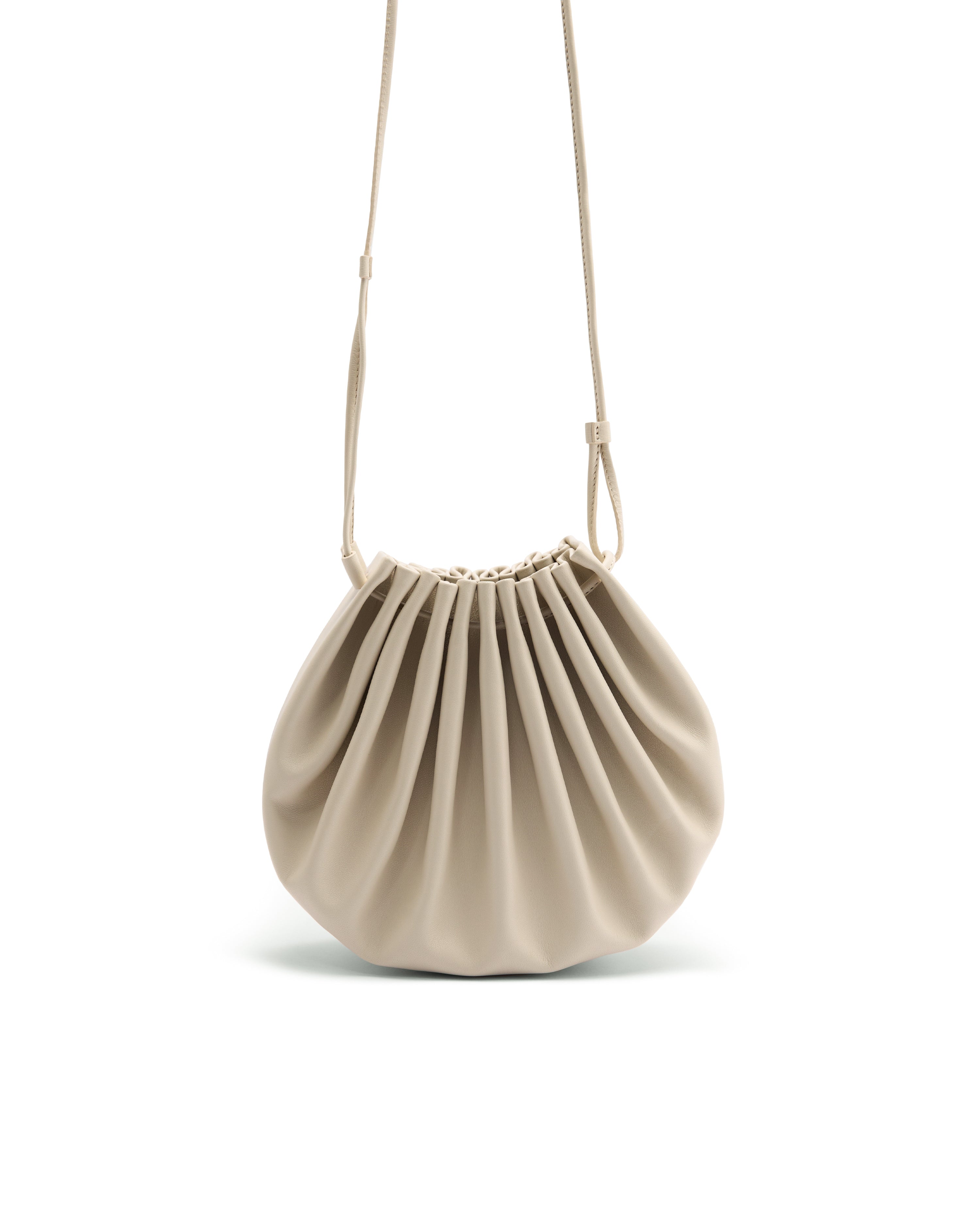 Poelle Atelier summer crossbody bag in beige with pleated design and adjustable strap