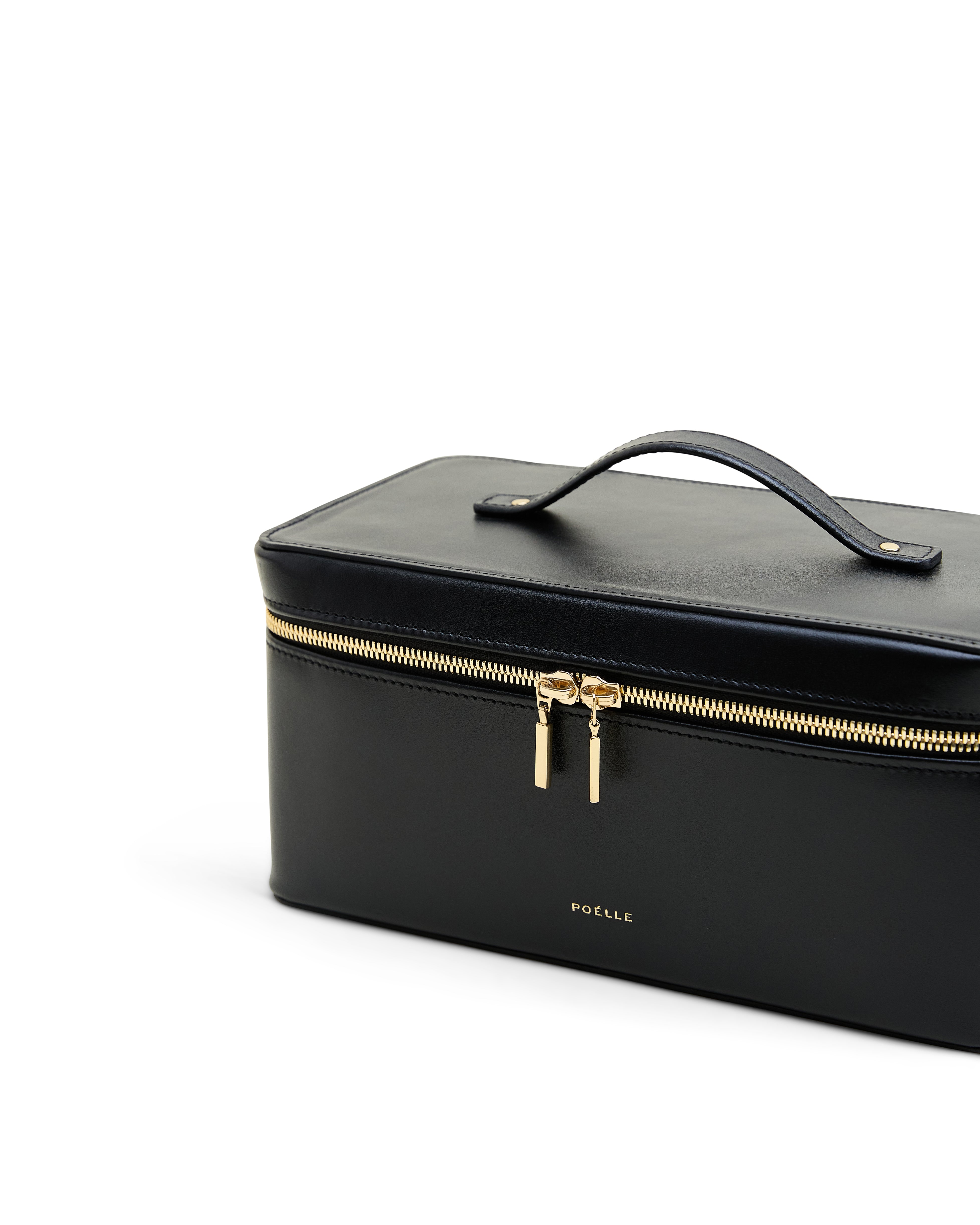 Poelle Atelier large leather makeup case in black with gold zipper and top handle