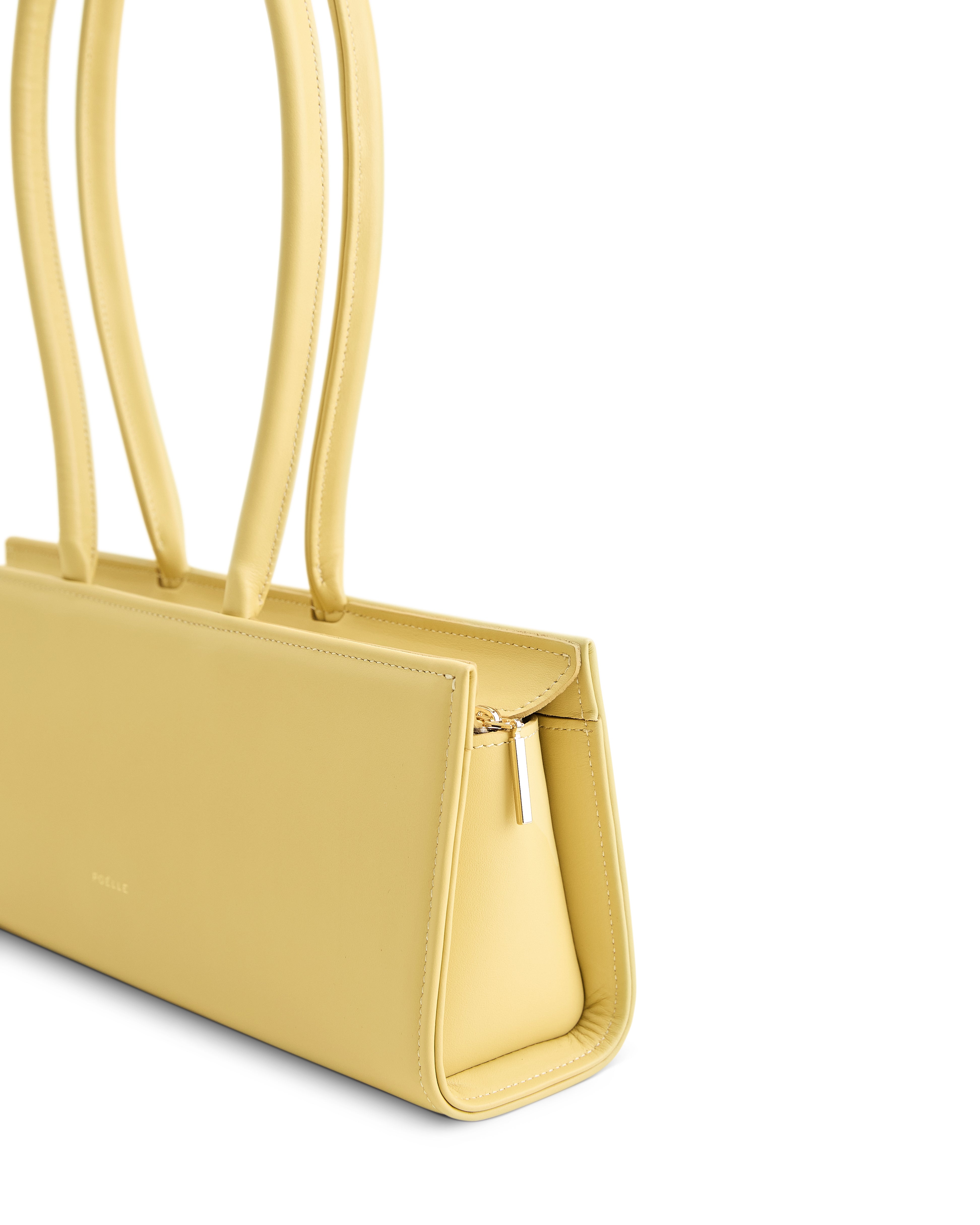 Poelle Atelier yellow leather handbag with slim structured design and double top handles