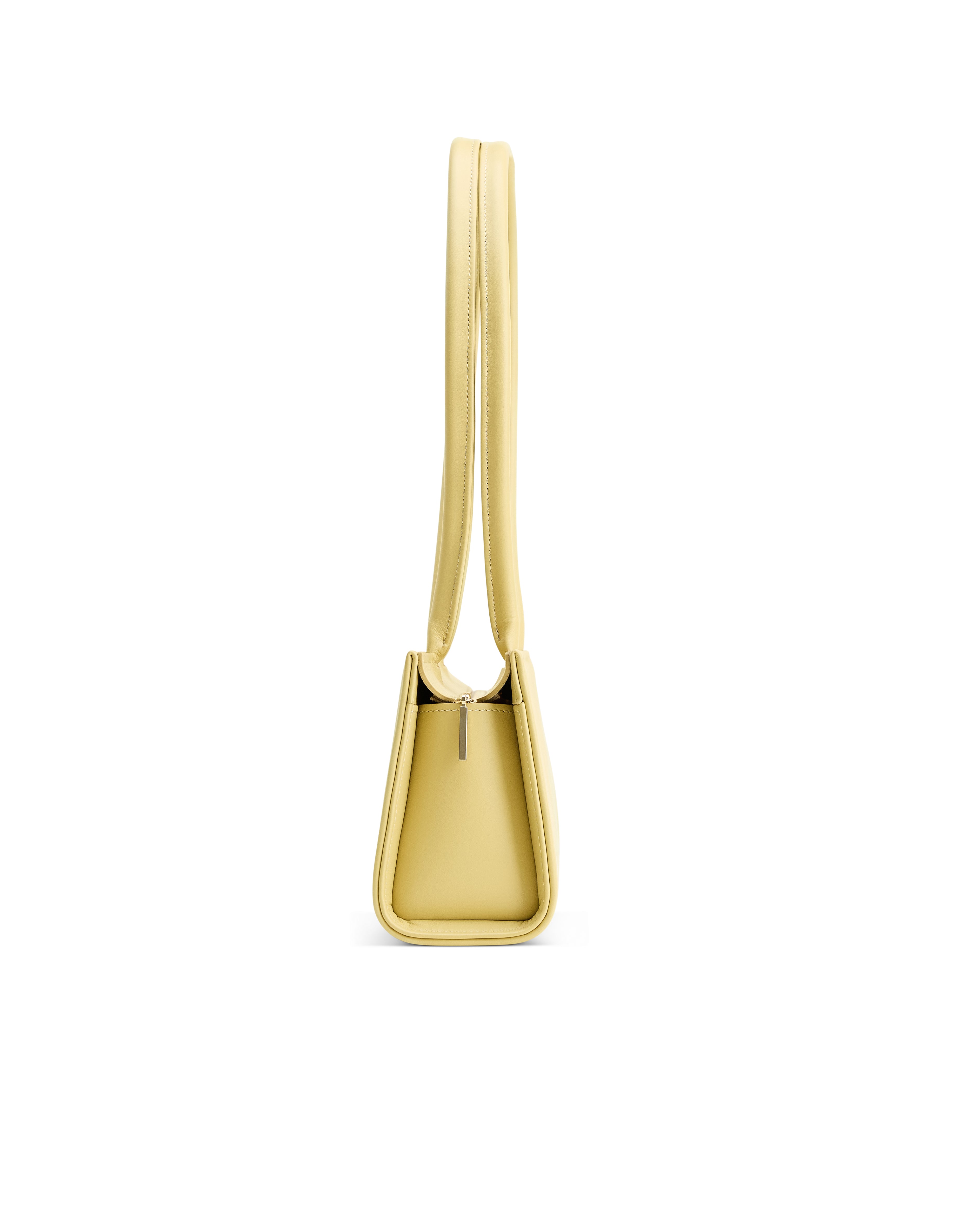 Side view of yellow leather handbag by Poelle Atelier with slim structured design and long strap