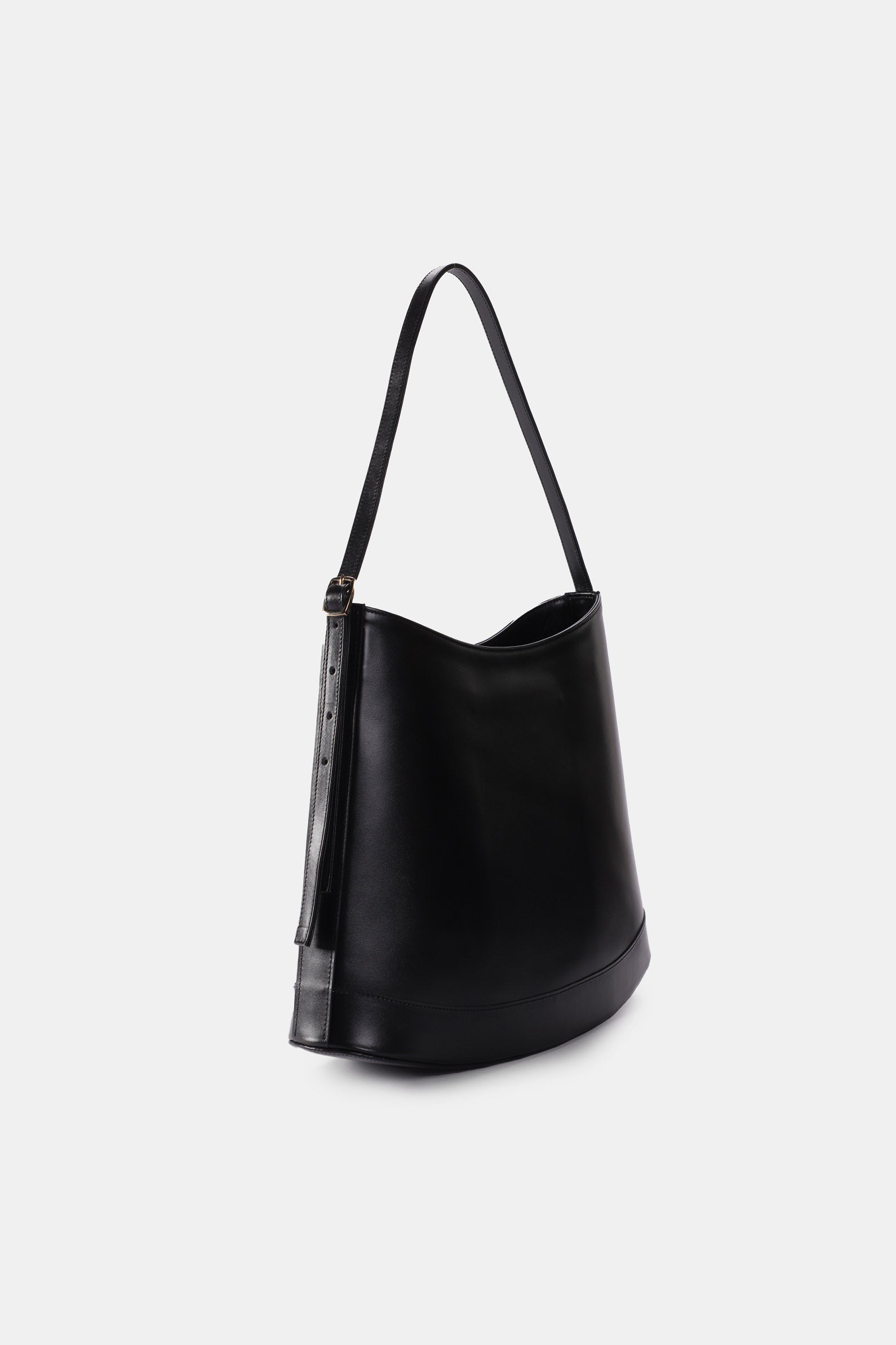 Poelle Atelier luxury minimalist sculptural bag in black leather with adjustable shoulder strap
