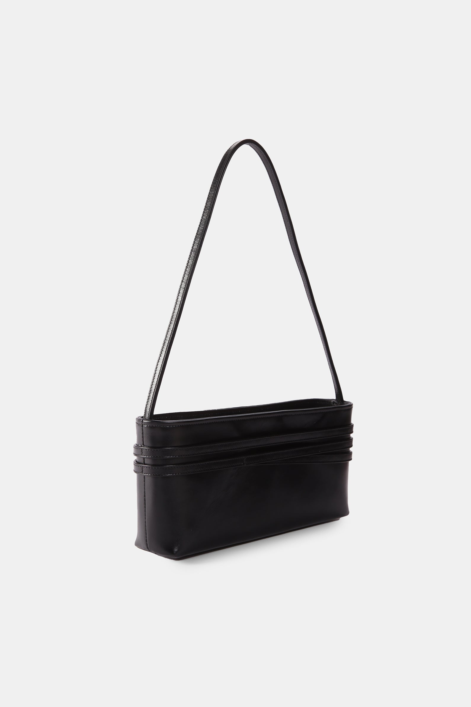 Poelle Atelier black leather luxury bag for women with sleek shoulder strap and minimalist design