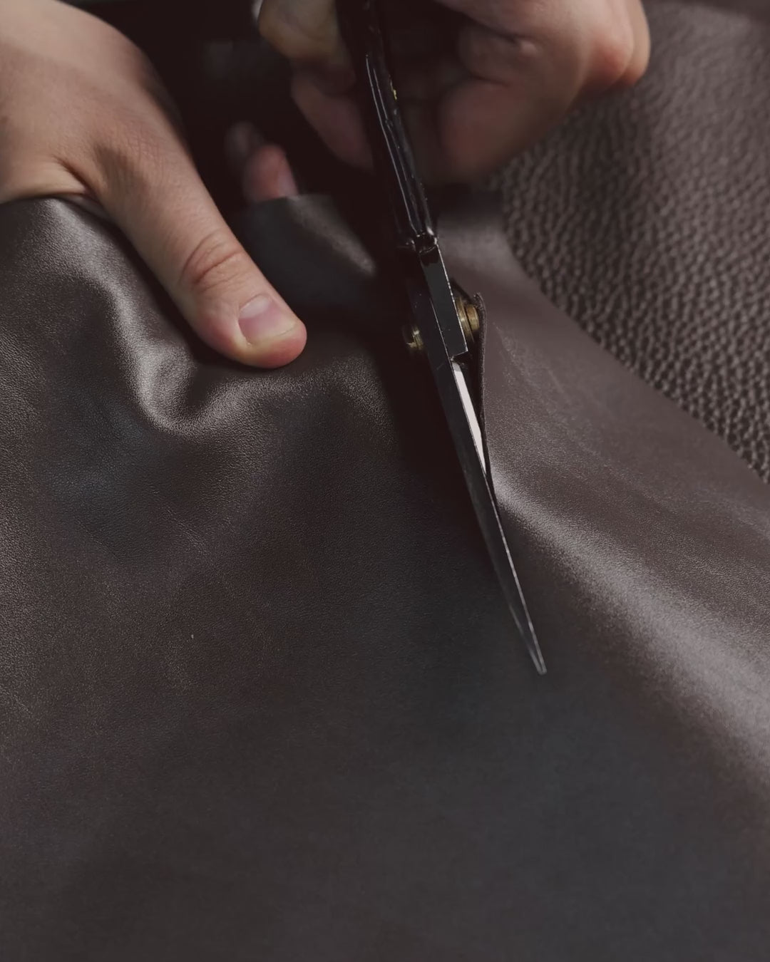 Cutting leather with scissors